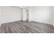 A bright bedroom featuring natural light, wood-look flooring, and neutral paint at 9973 Sw 107Th Ter, Ocala, FL 34481
