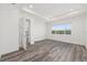 Bright bedroom features wood-look floors and a tray ceiling at 9973 Sw 107Th Ter, Ocala, FL 34481