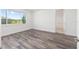 Bright bedroom with natural light, wood-look flooring, and neutral paint at 9973 Sw 107Th Ter, Ocala, FL 34481