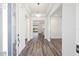 Bright and spacious foyer featuring elegant wood flooring, tray ceilings, and views to the backyard at 9973 Sw 107Th Ter, Ocala, FL 34481