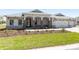 Attractive single-story home featuring stone pillar accents, arched entryway, and three car garage at 9973 Sw 107Th Ter, Ocala, FL 34481