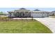 Beautiful single-story home features a stone-accented porch and a manicured lawn at 9973 Sw 107Th Ter, Ocala, FL 34481