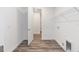 Spacious laundry room with wood-look floors and wire shelving at 9973 Sw 107Th Ter, Ocala, FL 34481