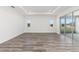 Bright and spacious living room featuring recessed lights, smooth floors, and sliding glass doors at 9973 Sw 107Th Ter, Ocala, FL 34481