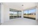 Covered lanai with sliding glass doors and a view of the yard, creating a versatile space for relaxing or entertaining at 9973 Sw 107Th Ter, Ocala, FL 34481