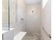 This tiled shower features a built-in bench and convenient grab bar at 9973 Sw 107Th Ter, Ocala, FL 34481
