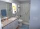 Bright bathroom with a glass-enclosed shower, and a vanity with ample counter space at 11653 Sw 72Nd Cir, Ocala, FL 34476