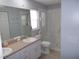 Bathroom with and sink, a vanity, and glass enclosed shower at 11653 Sw 72Nd Cir, Ocala, FL 34476