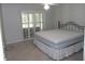 Light and airy bedroom boasts neutral walls and floors, creating a blank canvas for personalization at 11653 Sw 72Nd Cir, Ocala, FL 34476