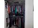 Organized closet with shelving, hanging rods, and clothing at 11653 Sw 72Nd Cir, Ocala, FL 34476