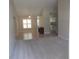 Bright living room features neutral tones, tiled floors, and an open layout, creating a welcoming atmosphere at 11653 Sw 72Nd Cir, Ocala, FL 34476