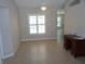 Bright living room with tile floors, plantation shutters, and desk at 11653 Sw 72Nd Cir, Ocala, FL 34476