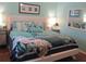 Comfortable bedroom featuring bright accents and stylish décor, including a decorative 