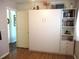 The bedroom features a Murphy bed with a side shelving unit at 12002 Sw 137Th Loop, Dunnellon, FL 34432