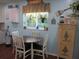Cozy breakfast nook area with bright window, unique decor, and seating for four at 12002 Sw 137Th Loop, Dunnellon, FL 34432