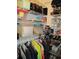 Walk-in closet with shelves and hanging rods for optimal storage at 12002 Sw 137Th Loop, Dunnellon, FL 34432