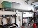 Garage featuring a well-organized storage system with shelving, hooks, and clear storage bins at 12002 Sw 137Th Loop, Dunnellon, FL 34432