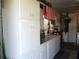 Organized garage featuring ample storage, including cabinets and a spacious workbench area at 12002 Sw 137Th Loop, Dunnellon, FL 34432