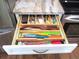 Organized kitchen drawer with custom dividers for cutlery, knives, and utensils at 12002 Sw 137Th Loop, Dunnellon, FL 34432