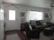Inviting living room showcasing comfortable seating, bright windows, and stylish decor elements at 12002 Sw 137Th Loop, Dunnellon, FL 34432