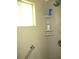 This features a glass shower with a grab bar and updated showerhead, providing both style and accessibility at 12002 Sw 137Th Loop, Dunnellon, FL 34432