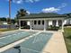 Enjoy a game of shuffleboard with this well-maintained shuffleboard court, perfect for outdoor recreation and community fun at 12002 Sw 137Th Loop, Dunnellon, FL 34432