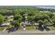 The aerial view shows the property near lush green trees, offering a sense of privacy and natural beauty at 12351 Se Hwy 464, Ocklawaha, FL 32179