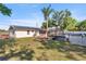 Spacious backyard with a deck, above ground pool, and solar panels on the home's roof at 12351 Se Hwy 464, Ocklawaha, FL 32179