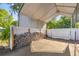 Spacious carport, perfect for parking or storage, with a durable concrete floor at 12351 Se Hwy 464, Ocklawaha, FL 32179
