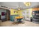 Bright dining area with a ceiling fan, breakfast table, and easy access to the backyard at 12351 Se Hwy 464, Ocklawaha, FL 32179