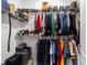 Walk-in closet with metal shelving and hanging clothes providing ample storage for an organized lifestyle at 13423 Sw 48Th Ave, Ocala, FL 34473