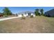 Attractive single-story home featuring a sprawling yard and a two-car garage with a convenient driveway at 13423 Sw 48Th Ave, Ocala, FL 34473