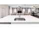 Modern kitchen with white countertops overlooking the living space, ideal for entertaining and Gathering gatherings at 13423 Sw 48Th Ave, Ocala, FL 34473