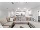 Comfortable living room featuring a spacious sectional sofa, recessed lighting, and an open concept design at 13423 Sw 48Th Ave, Ocala, FL 34473