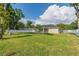 Spacious backyard with lush green grass and a white privacy fence at 13588 Se 102Nd Ct, Belleview, FL 34420