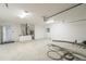 Large garage with overhead lighting and plenty of storage space at 13588 Se 102Nd Ct, Belleview, FL 34420