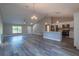 Open floor plan featuring durable floors, stainless appliances, modern fixtures and plenty of natural light at 13588 Se 102Nd Ct, Belleview, FL 34420