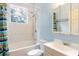 Well-lit bathroom features a shower and bath combination with a sink vanity and medicine cabinet at 16295 W Highway 40, Ocala, FL 34481