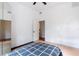 A bright bedroom with neutral walls, and light hardwood flooring at 16295 W Highway 40, Ocala, FL 34481