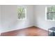 Bright bedroom featuring sleek wood floors and a window overlooking the beautiful outdoors at 16295 W Highway 40, Ocala, FL 34481