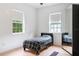 A bedroom featuring natural light, hardwood floors, and a large wardrobe at 16295 W Highway 40, Ocala, FL 34481