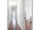 Hallway view includes a bedroom and a bathroom with hardwood floors at 16295 W Highway 40, Ocala, FL 34481