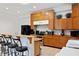 Kitchen with stainless steel appliances, wooden countertops, custom cabinets, and bar-style seating at 16295 W Highway 40, Ocala, FL 34481