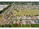 Residential aerial view, featuring neatly arranged houses and a green golf course at 16299 Sw 14Th Avenue Rd, Ocala, FL 34473