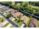This home features a screened-in lanai, solar panels, an attached garage, and a well maintained lawn at 16299 Sw 14Th Avenue Rd, Ocala, FL 34473