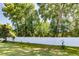 Backyard featuring lush green grass and a white fence at 16299 Sw 14Th Avenue Rd, Ocala, FL 34473