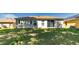 Lush backyard showing manicured grass and the home's exterior, creating a peaceful retreat at 16299 Sw 14Th Avenue Rd, Ocala, FL 34473