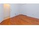 Spacious bedroom showcasing hardwood floors and closet for ample storage at 16299 Sw 14Th Avenue Rd, Ocala, FL 34473