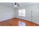 Bedroom with wood floors, ceiling fan, and plenty of natural light at 16299 Sw 14Th Avenue Rd, Ocala, FL 34473
