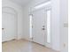 Bright entryway with tiled floor, white door and sidelights at 16299 Sw 14Th Avenue Rd, Ocala, FL 34473